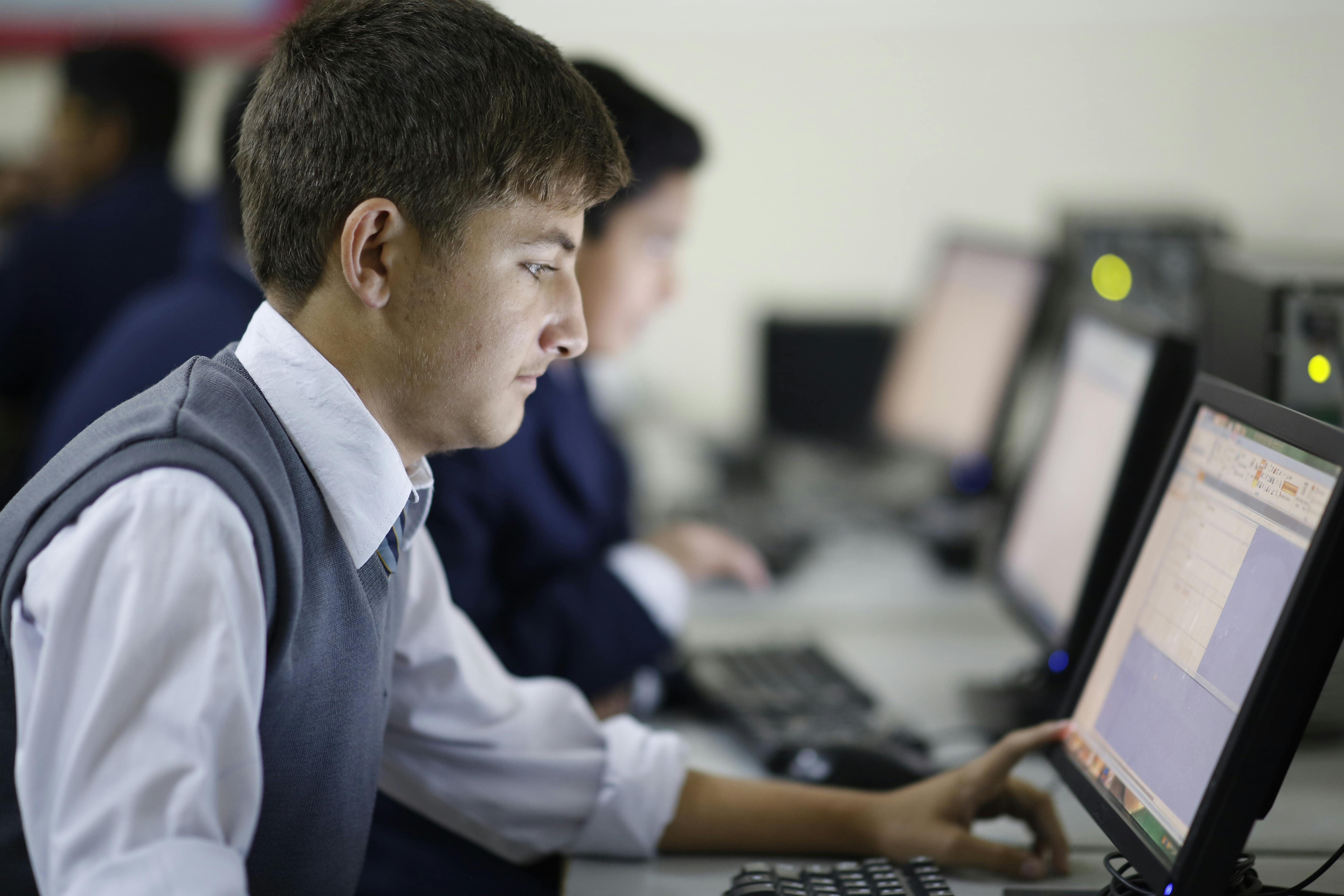 Students learning in the computer lab at Top Tech Computer College